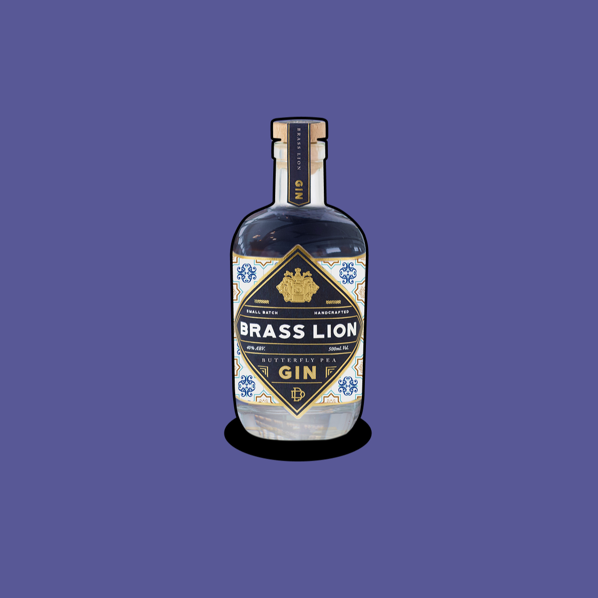 Brass Lion Butterfly Pea Gin bottle on a purple background.