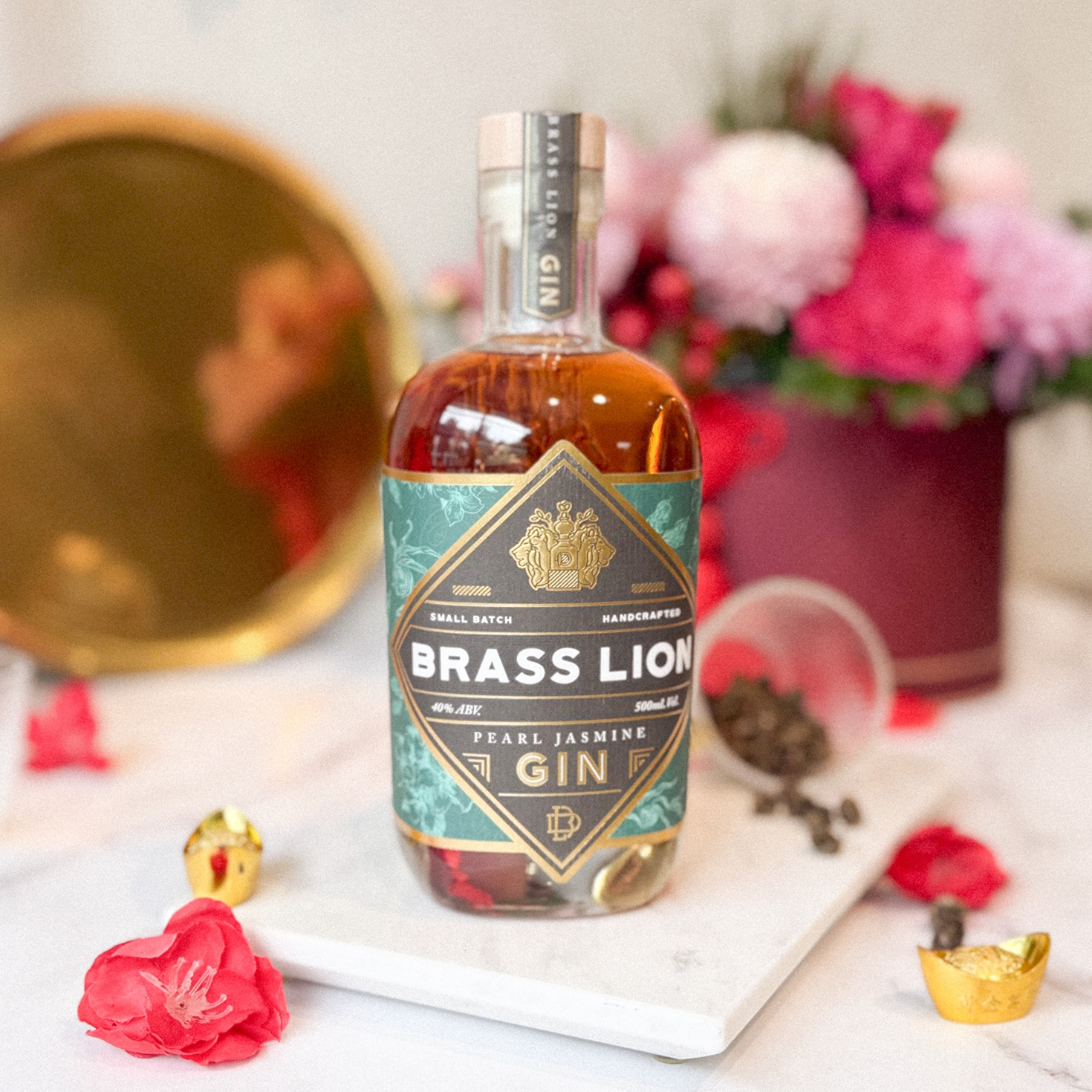 Brass Lion Pearl Jasmine Gin bottle styled with floral decorations