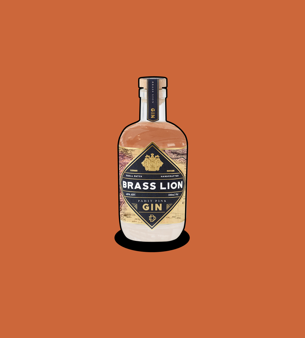 Brass Lion Pahit Pink Gin bottle on an earthy orange background.