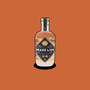 Brass Lion Pahit Pink Gin bottle on an earthy orange background.
